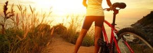 woman looking over bike trail