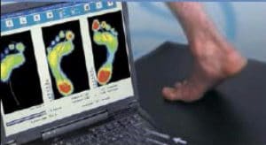 foot on a pad with heat signatures on screen 